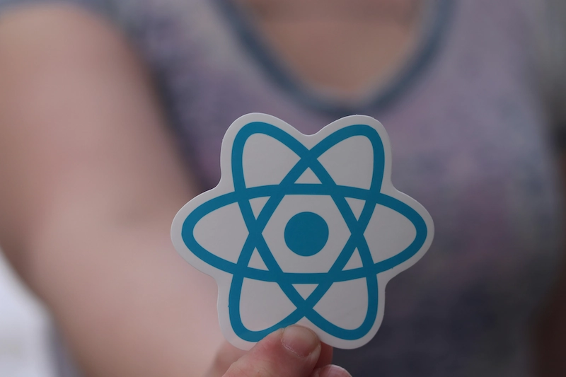 Image of a person holding the react icon